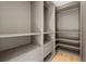 Large walk-in closet with ample shelving and drawers at 986 Excellence Cir, Ocoee, FL 34761