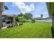 Large backyard with lush green grass and a white fence at 2531 Lyndscape St, Orlando, FL 32833