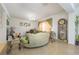 Living room with green sectional and decorative clock at 2531 Lyndscape St, Orlando, FL 32833