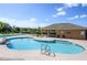 Community pool with a covered patio and lounge chairs at 2531 Lyndscape St, Orlando, FL 32833