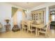 Formal dining room with wooden table and hutch at 2531 Lyndscape St, Orlando, FL 32833