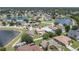 Aerial view of a house and neighborhood with lakes at 2531 Lyndscape St, Orlando, FL 32833