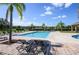 Relaxing community pool with lounge chairs at 2531 Lyndscape St, Orlando, FL 32833