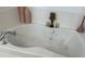 Relax in this updated bathroom, featuring a large bathtub and modern vanity at 2531 Lyndscape St, Orlando, FL 32833