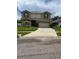 Two-story house with a landscaped yard and attached garage at 2531 Lyndscape St, Orlando, FL 32833