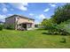 Spacious backyard with a screened patio and mature trees at 2531 Lyndscape St, Orlando, FL 32833