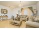 Bright living room with ornate furniture and chandelier at 2531 Lyndscape St, Orlando, FL 32833