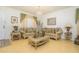 Living room featuring beige couches and hardwood floors at 2531 Lyndscape St, Orlando, FL 32833