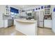 Modern kitchen with island and stainless steel appliances at 2531 Lyndscape St, Orlando, FL 32833