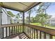 Enjoy the view from this screened balcony, overlooking lush landscaping at 115 Springwood Cir # C, Longwood, FL 32750