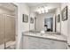 Bathroom with double vanity, granite countertop and large shower at 8810 Macapa Dr, Kissimmee, FL 34747