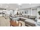 Open living area with a large sectional sofa and kitchen views at 8810 Macapa Dr, Kissimmee, FL 34747