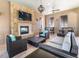 Community room with fireplace, seating area, and TV at 8810 Macapa Dr, Kissimmee, FL 34747