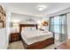 Bedroom with a queen bed, and wood furniture at 8810 Macapa Dr, Kissimmee, FL 34747