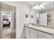 Bathroom with single vanity, granite countertop, and access to bedroom at 8810 Macapa Dr, Kissimmee, FL 34747
