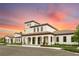 Elegant clubhouse at sunset, featuring architectural details at 8810 Macapa Dr, Kissimmee, FL 34747