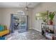 Bright Florida room with pool view, tile floors, and access to the outdoors at 2635 Quarterdeck Ct, Kissimmee, FL 34743