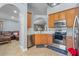 Well-equipped kitchen with stainless steel appliances and light wood cabinets at 2635 Quarterdeck Ct, Kissimmee, FL 34743