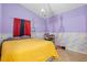Cozy bedroom with yellow bedding and unique wall decor at 2635 Quarterdeck Ct, Kissimmee, FL 34743