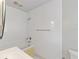 Clean bathroom with shower/tub combo and white tile at 6809 Ambassador Dr, Orlando, FL 32818