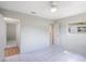 Spacious bedroom with tile floors and access to another room at 6809 Ambassador Dr, Orlando, FL 32818