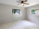 Bright bedroom with tile floors, ceiling fan and window at 6809 Ambassador Dr, Orlando, FL 32818