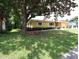 Ranch-style home with mature landscaping and large yard at 6809 Ambassador Dr, Orlando, FL 32818