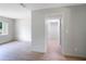 Hallway with light walls and flooring at 6809 Ambassador Dr, Orlando, FL 32818