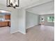 Bright dining area with kitchen view and wood-look floors at 6809 Ambassador Dr, Orlando, FL 32818
