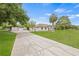 Long driveway leading to a home with detached garage at 32131 Hickory Ln, Sorrento, FL 32776