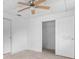 Spacious bedroom with ample closet space and ceiling fan at 1404 E Alfred St, Tavares, FL 32778