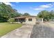House with a large front yard and street view at 1404 E Alfred St, Tavares, FL 32778