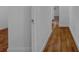 Hardwood floors in a bright hallway leading to bedrooms at 1404 E Alfred St, Tavares, FL 32778