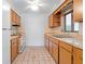 View of kitchen with appliances and tile floor at 1404 E Alfred St, Tavares, FL 32778