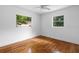Bedroom with hardwood floors and large windows at 1404 E Alfred St, Tavares, FL 32778