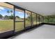 Spacious screened porch overlooking backyard at 1404 E Alfred St, Tavares, FL 32778