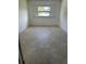 Bright bedroom with tile flooring and large window at 1404 E Alfred St, Tavares, FL 32778
