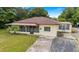 Ranch style home with carport and large yard at 1404 E Alfred St, Tavares, FL 32778