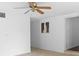 Bright living area with ceiling fan and view to kitchen at 1404 E Alfred St, Tavares, FL 32778