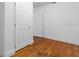 Bedroom with hardwood floors and double door closet at 1404 E Alfred St, Tavares, FL 32778