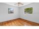 Well-lit bedroom with hardwood floors and ceiling fan at 1404 E Alfred St, Tavares, FL 32778