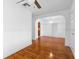 Bright dining room with hardwood floors and arched entryways at 1404 E Alfred St, Tavares, FL 32778