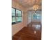 Dining room with hardwood floors and large windows at 1404 E Alfred St, Tavares, FL 32778