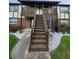 Two story building exterior with stairs and landscaping at 5329 Hansel Ave # B-4, Edgewood, FL 32809