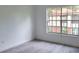 Spacious bedroom with large window and vinyl plank flooring at 5329 Hansel Ave # B-4, Edgewood, FL 32809