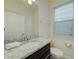 Small bathroom with granite countertop and single sink vanity at 4063 Lana Ave, Davenport, FL 33897