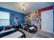 Race-car themed bedroom with twin beds at 4063 Lana Ave, Davenport, FL 33897