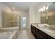 Double vanity bathroom with granite countertop and large shower at 4063 Lana Ave, Davenport, FL 33897