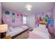 Charming princess-themed bedroom with twin beds at 4063 Lana Ave, Davenport, FL 33897
