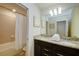 Double vanity bathroom with granite countertop and bathtub at 4063 Lana Ave, Davenport, FL 33897
